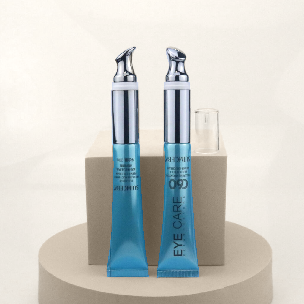 Two blue eye cream tubes with metal applicator tips